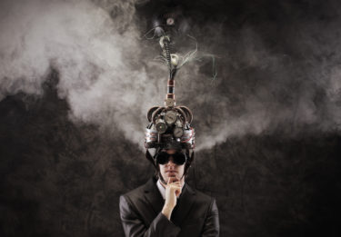 Business man wearing a brain-control helmet, forced ideas extraction